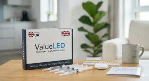 A detailed close-up of the ValueLED whitening kit components, including gel syringes and a tooth shade guide, arranged in natural daylight.