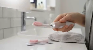 Close-up of interchangeable soft silicone heads included with a budget electric gum massager for sensitive gums.