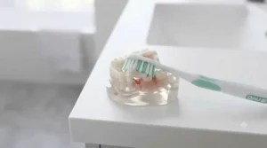 Diagram demonstrating the correct 45-degree angle technique when using a toothbrush and toothpaste set for gum recession.
