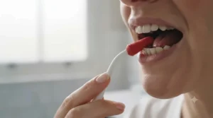 Step-by-step demonstration of using a traditional rubber tip stimulator along the gumline for plaque removal.